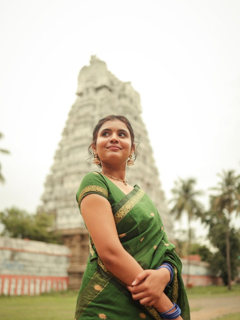 Earth-toned green fabric complements Arul Jyothi's natural photography lighting