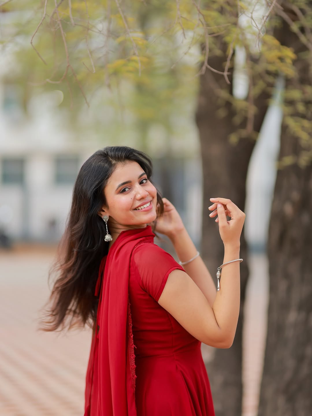 Traditional red chudidhar highlights Arul Jyothi's South Indian cultural fashion heritage