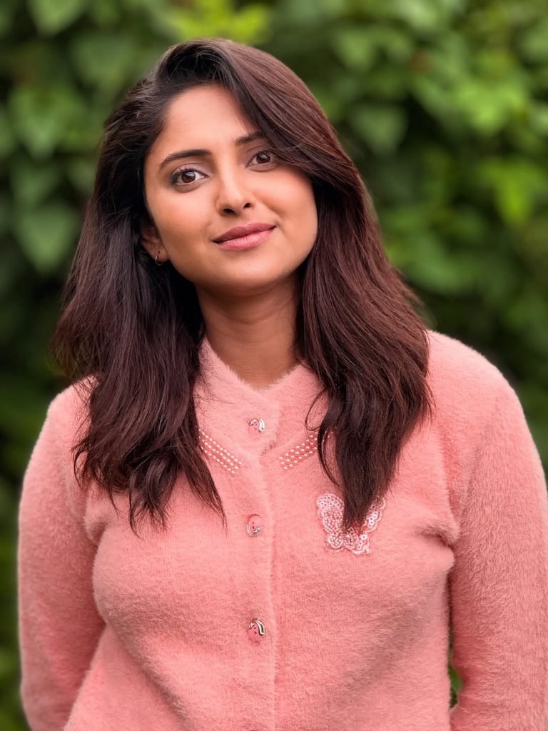 Garden greenery provides organic backdrop for Aysha's natural beauty