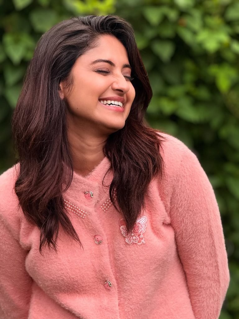 Garden greenery provides organic backdrop for Aysha's natural beauty