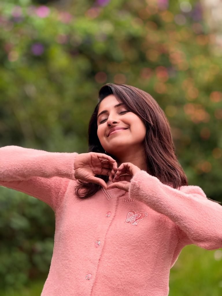 Garden greenery provides organic backdrop for Aysha's natural beauty