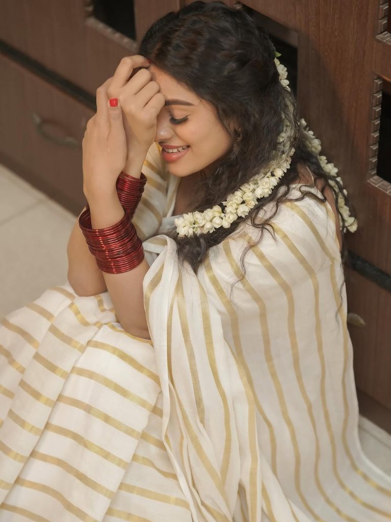 Delna Davis embodies cultural grace in pristine white saree ensemble