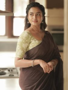 Janani Ashok Kumar embodies natural elegance in brown saree with olive green blouse