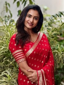 Janani Ashok Kumar embodies elegance in red saree with intricate gold zari work