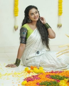 Janani Ashok Kumar embodies sophistication in white saree with detailed green embroidery