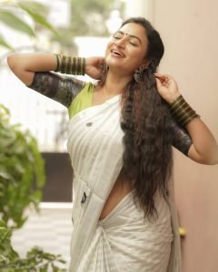 Janani Ashok Kumar embodies sophistication in white saree with detailed green embroidery