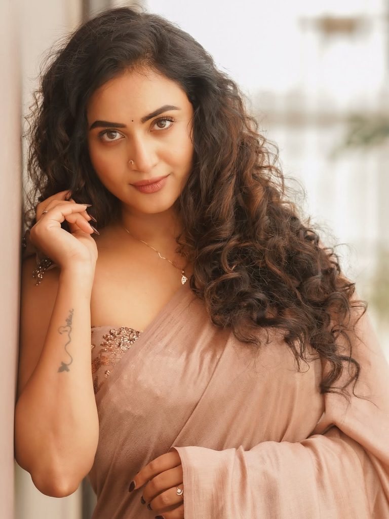 Soft brown draping creates elegant silhouette for Janani Ashok Kumar's styling