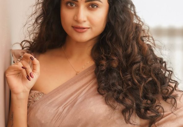 Soft brown draping creates elegant silhouette for Janani Ashok Kumar's styling