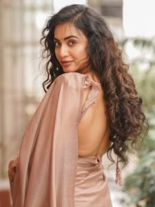 Soft brown draping creates elegant silhouette for Janani Ashok Kumar's styling