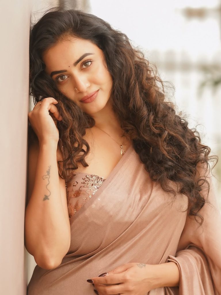 Soft brown draping creates elegant silhouette for Janani Ashok Kumar's styling