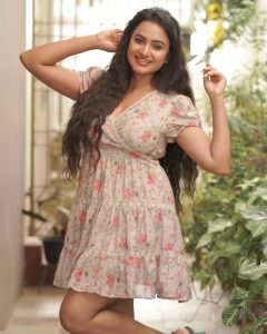 Casual outdoor styling showcases Janani Ashok Kumar's pink floral mini dress charm