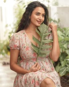 Casual outdoor styling showcases Janani Ashok Kumar's pink floral mini dress charm