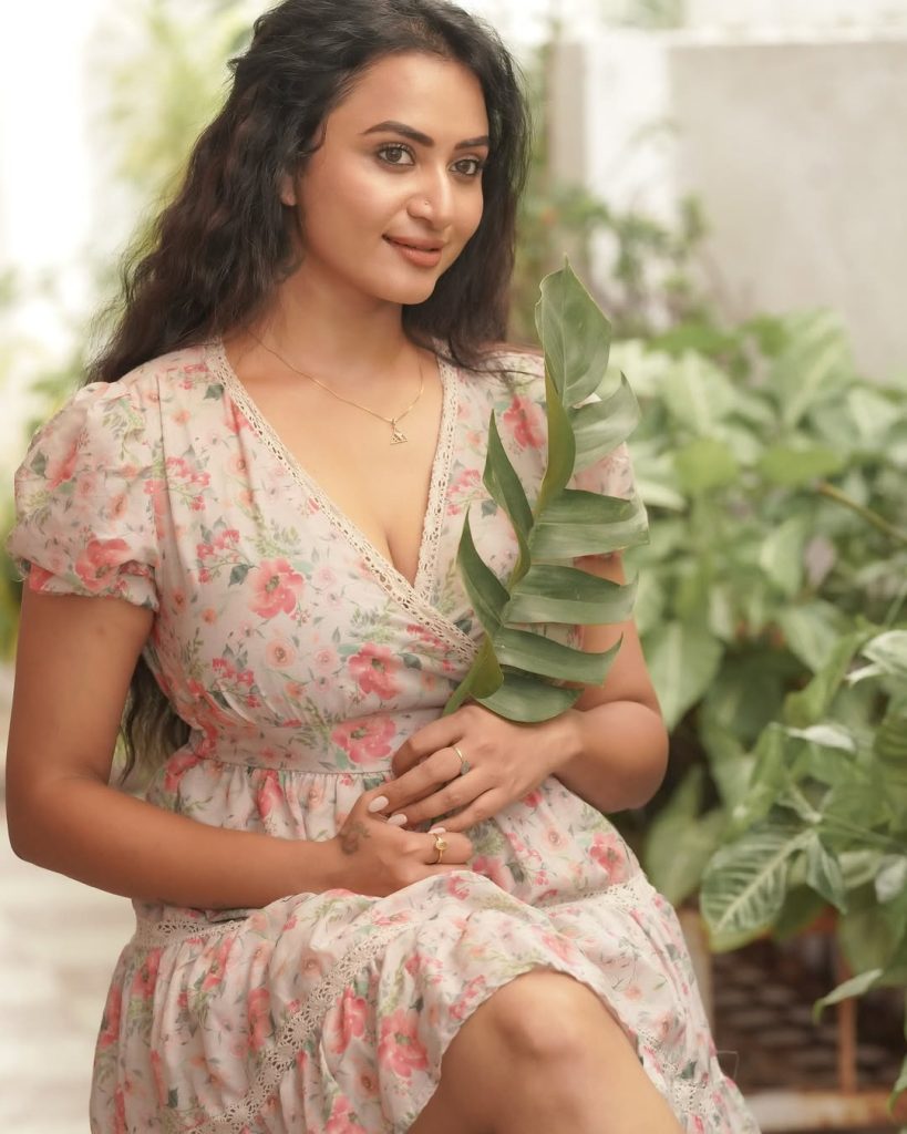 Casual outdoor styling showcases Janani Ashok Kumar's pink floral mini dress charm