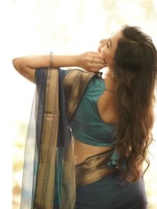Janani Ashok Kumar embodies sophistication in saree with beautiful curled hair