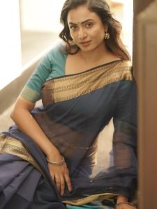 Janani Ashok Kumar embodies sophistication in saree with beautiful curled hair