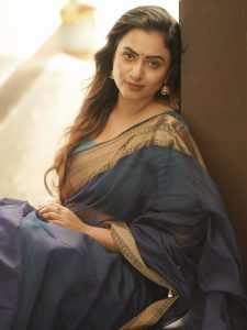 Janani Ashok Kumar embodies sophistication in saree with beautiful curled hair