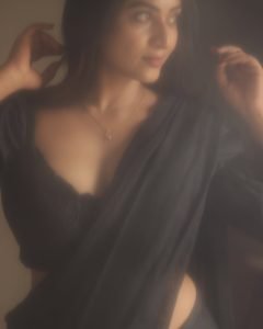 Janani Ashok Kumar embodies timeless sophistication in black saree with natural lighting