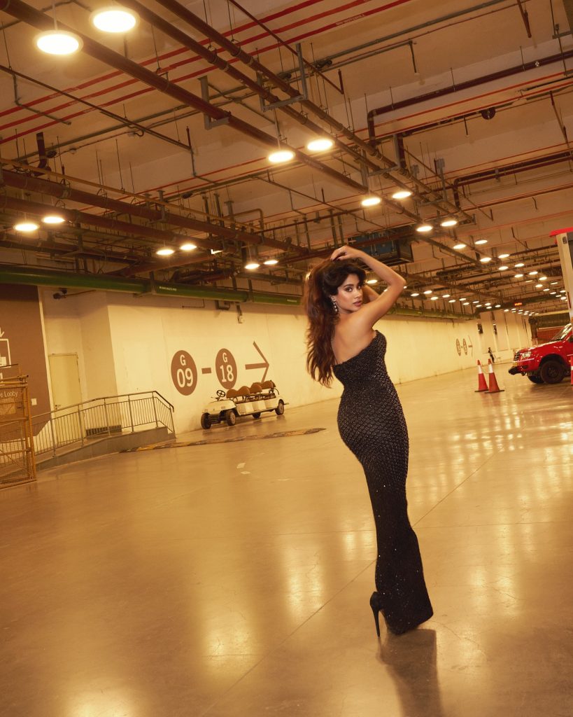 Janhvi's confident pose highlights sleek black dress silhouette