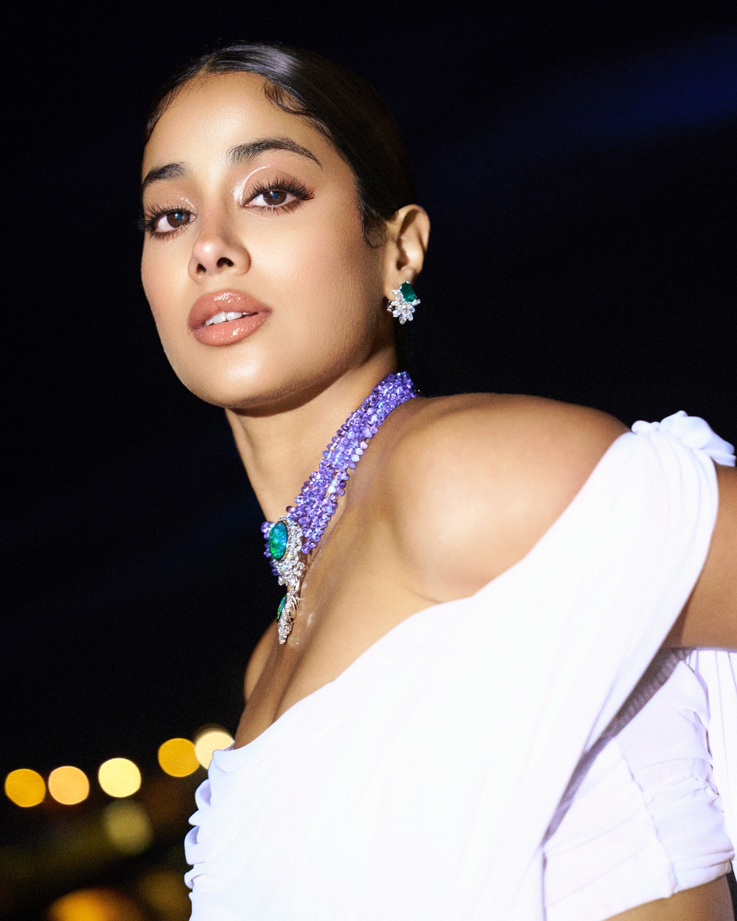 Clean white styling emphasizes Janhvi's natural beauty and charm
