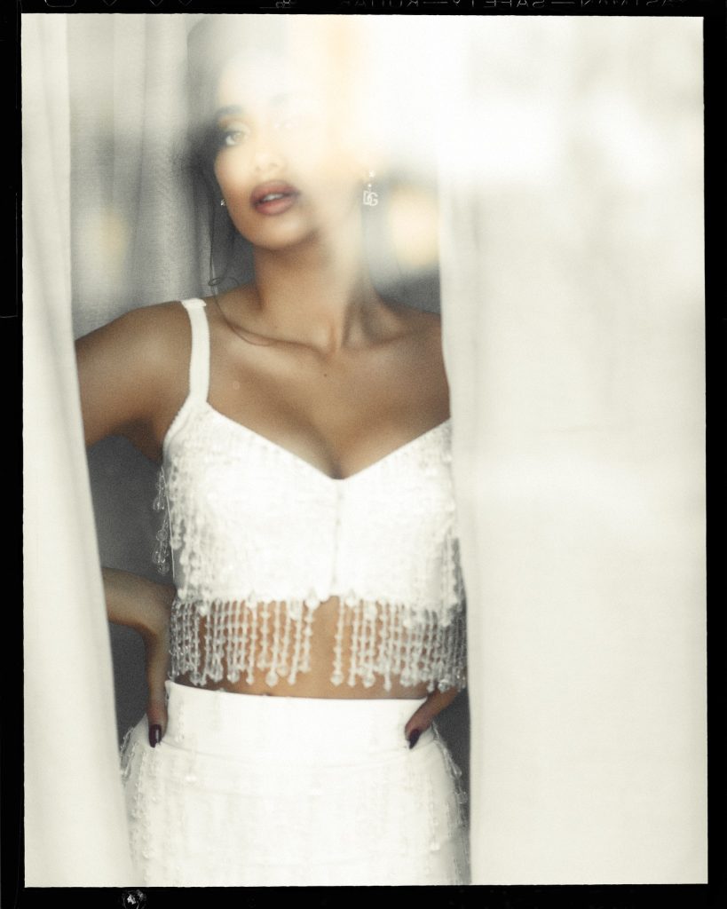 Classic black white styling creates sophisticated visual impact for Janhvi