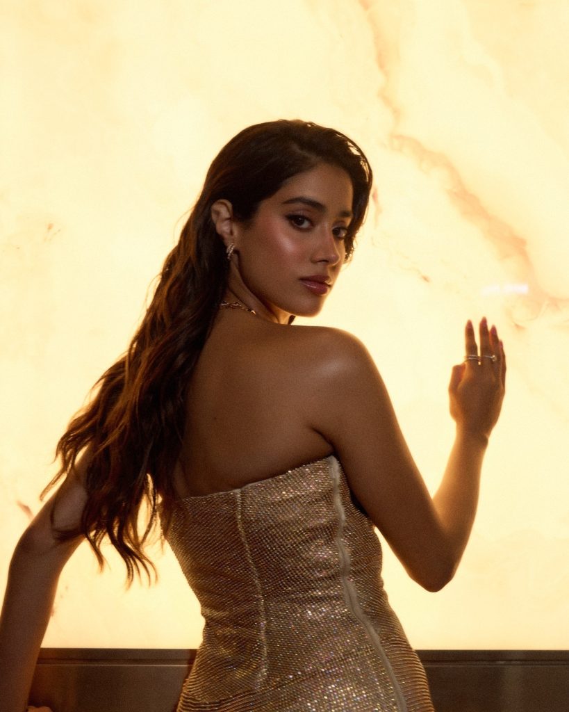 Metallic golden fabric catches light beautifully in Janhvi's portrait