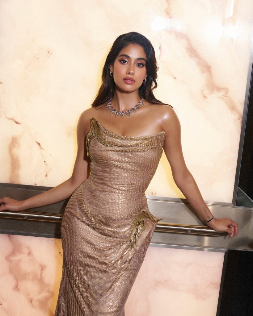 Metallic golden fabric catches light beautifully in Janhvi's portrait