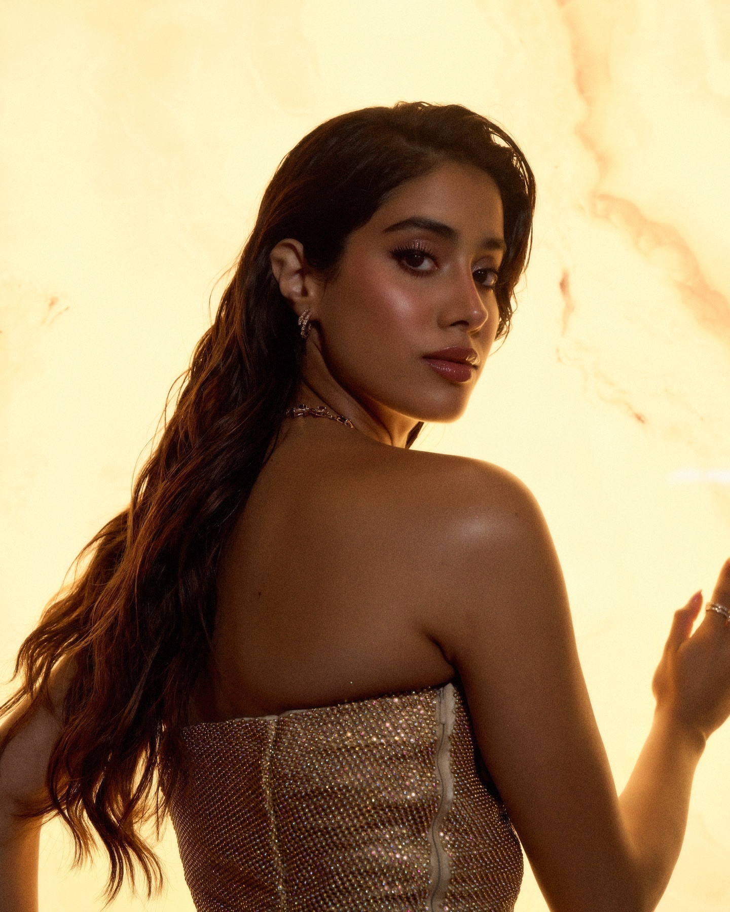 Opulent golden styling reflects Janhvi's high-fashion sensibilities