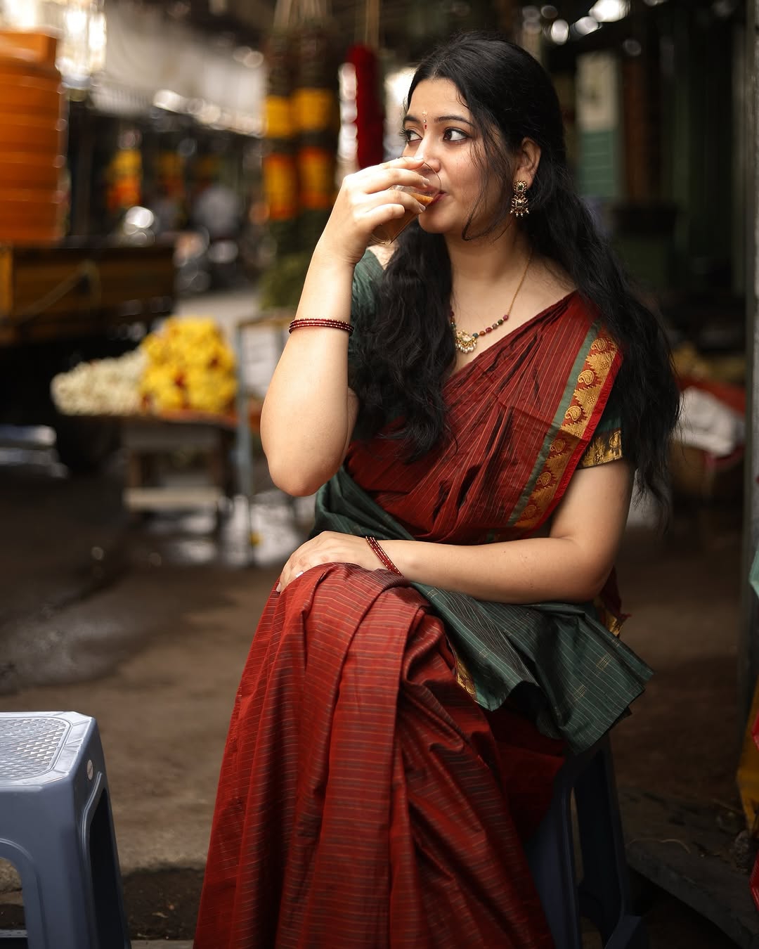 Adorable styling in deep maroon creates heartwarming portrait effect for Kanduri Sudha