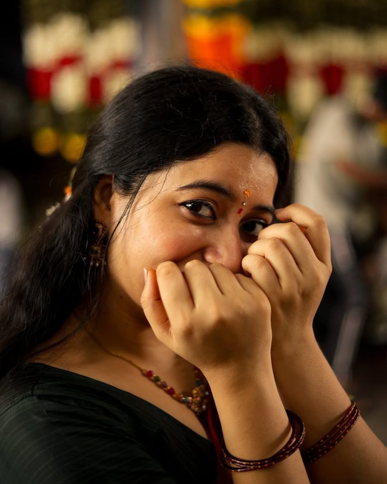 Warm maroon tones create cozy, inviting traditional styling atmosphere for Kanduri Sudha