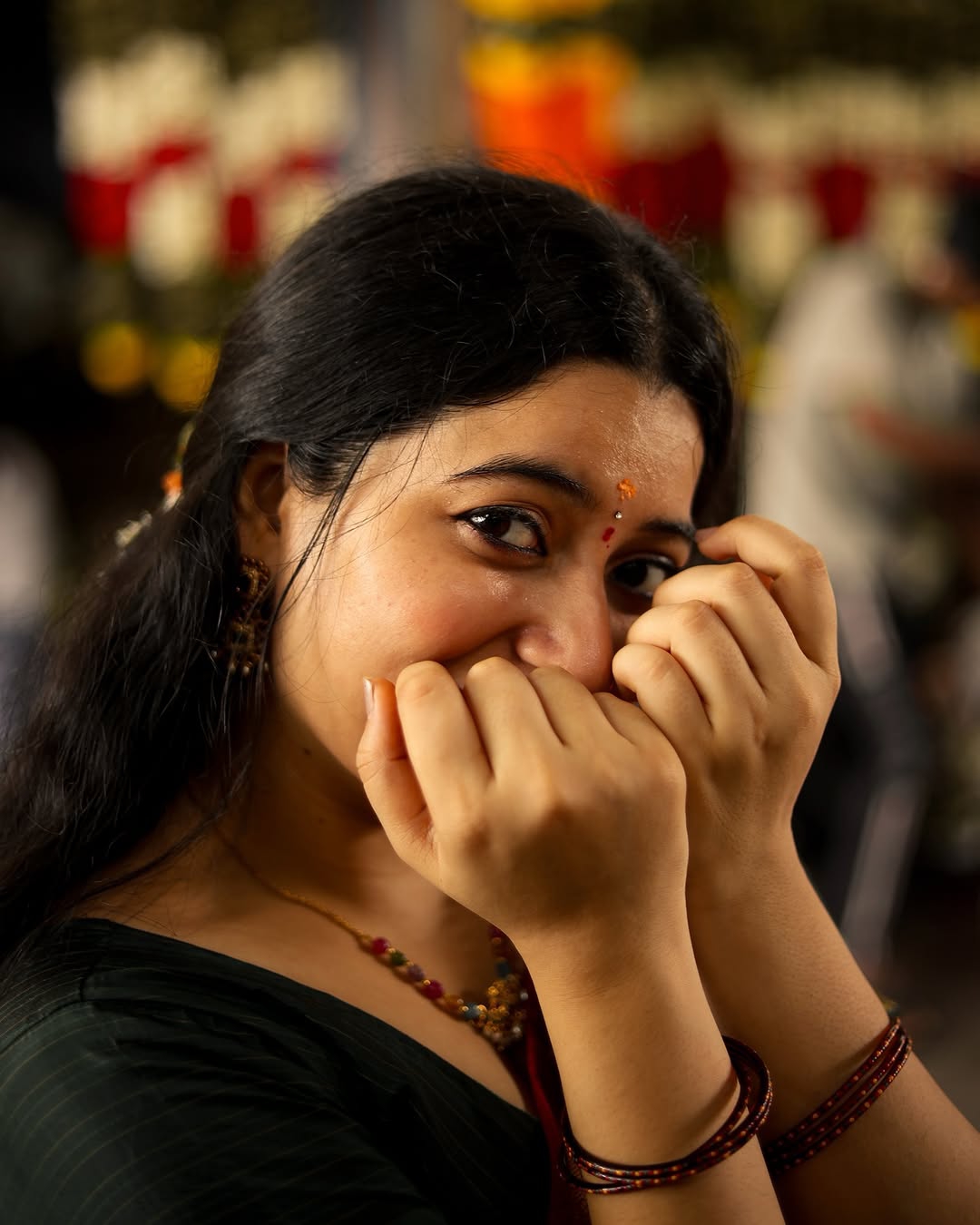 Warm maroon tones create cozy, inviting traditional styling atmosphere for Kanduri Sudha