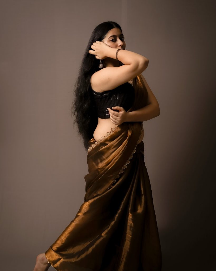 Warm brown tones complement Kanduri Sudha's natural complexion perfectly