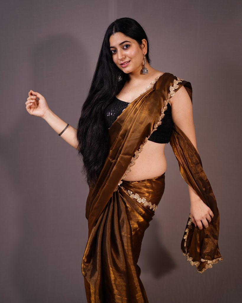 Kanduri Sudha showcases earthy brown traditional wear with golden accessories