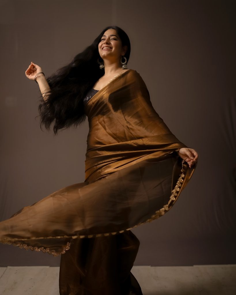 Warm brown tones complement Kanduri Sudha's natural complexion perfectly