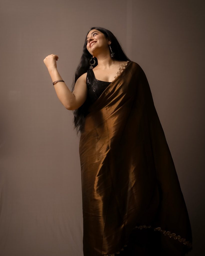 Warm brown tones complement Kanduri Sudha's natural complexion perfectly