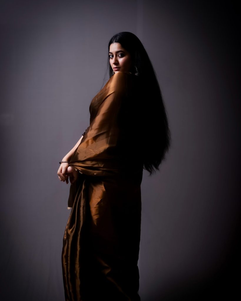 Warm brown tones complement Kanduri Sudha's natural complexion perfectly