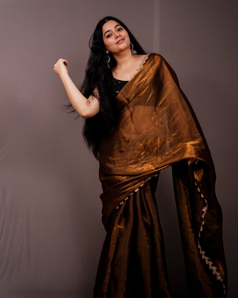 Warm brown tones complement Kanduri Sudha's natural complexion perfectly