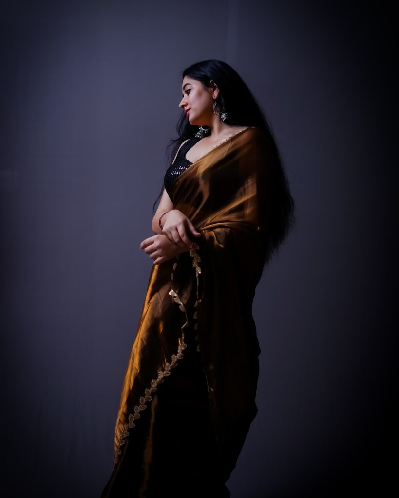Kanduri Sudha showcases earthy brown traditional wear with golden accessories