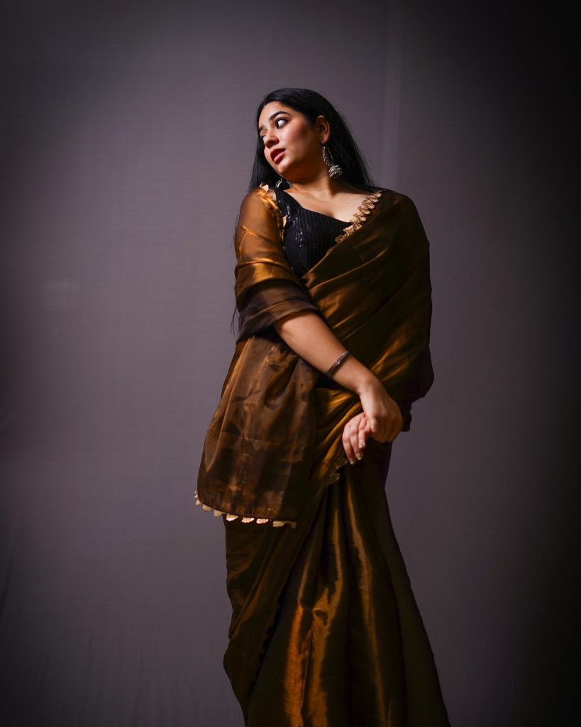 Kanduri Sudha showcases earthy brown traditional wear with golden accessories