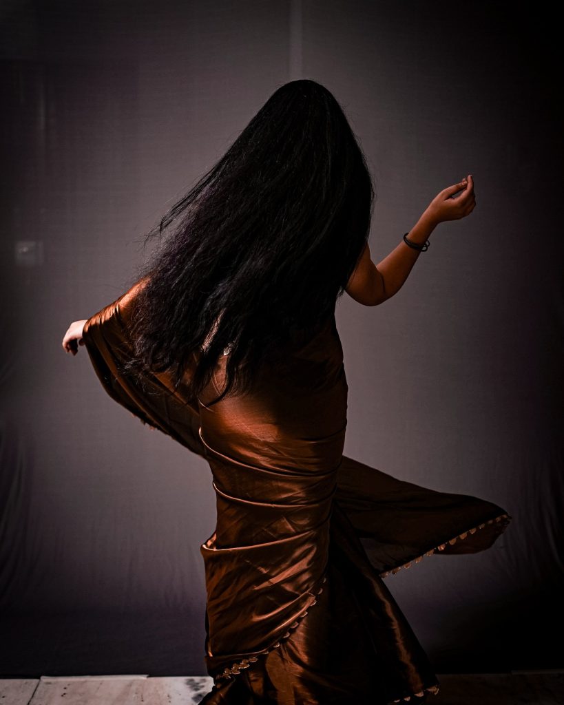 Kanduri Sudha showcases earthy brown traditional wear with golden accessories