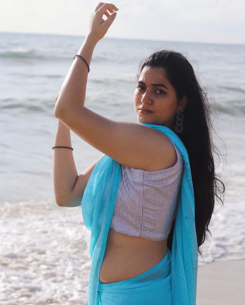 setting enhances the ethereal blue saree worn by Kanduri Sudha