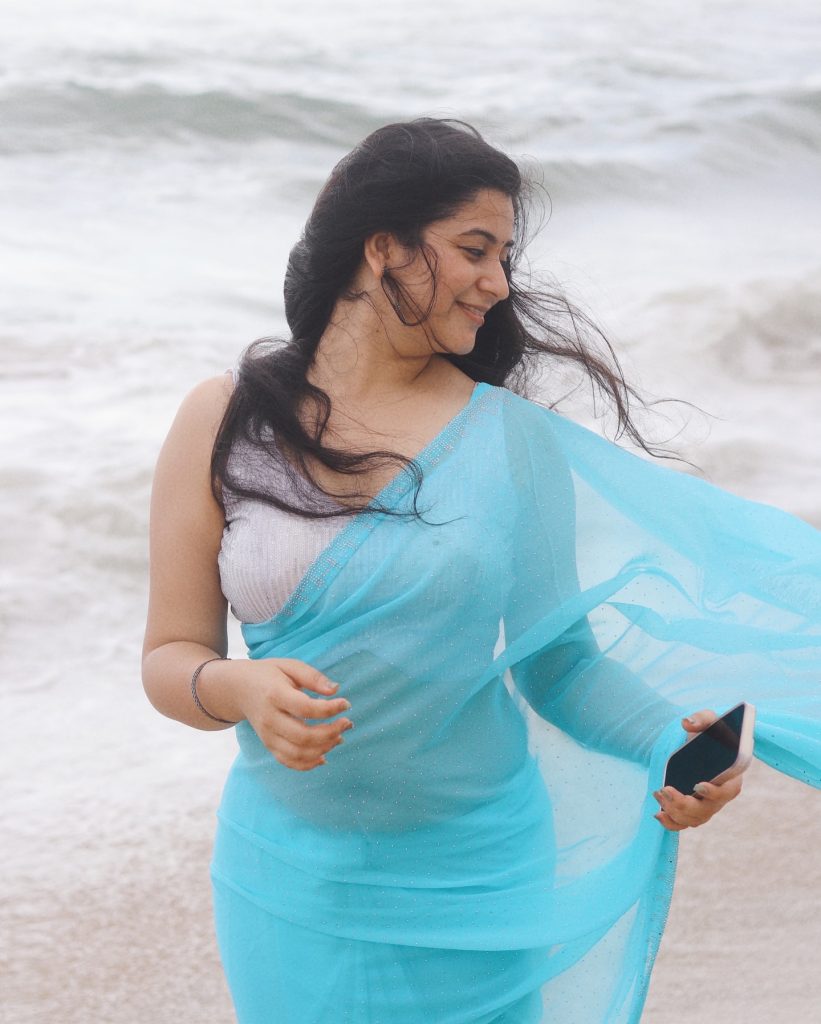 setting enhances the ethereal blue saree worn by Kanduri Sudha