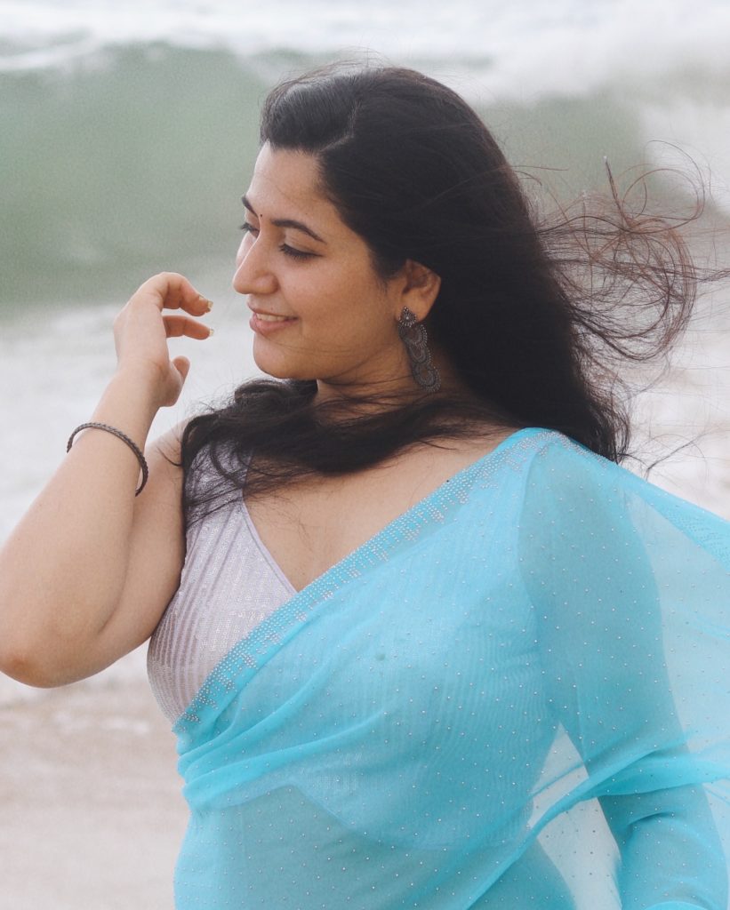 setting enhances the ethereal blue saree worn by Kanduri Sudha