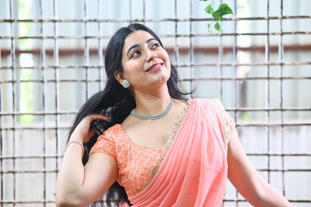 Feminine pink drape enhances Kanduri Sudha's natural beauty and charm