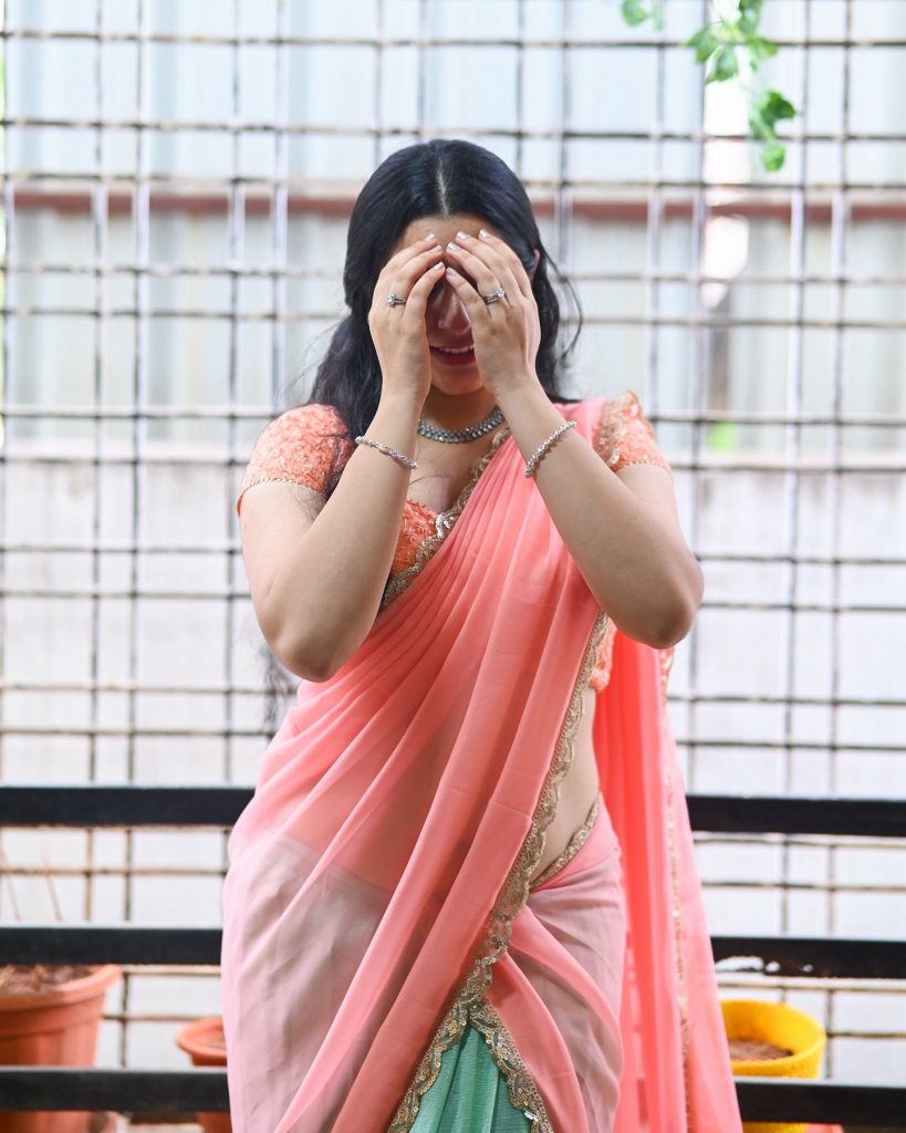 Sudha radiates confidence in rose-colored traditional ensemble