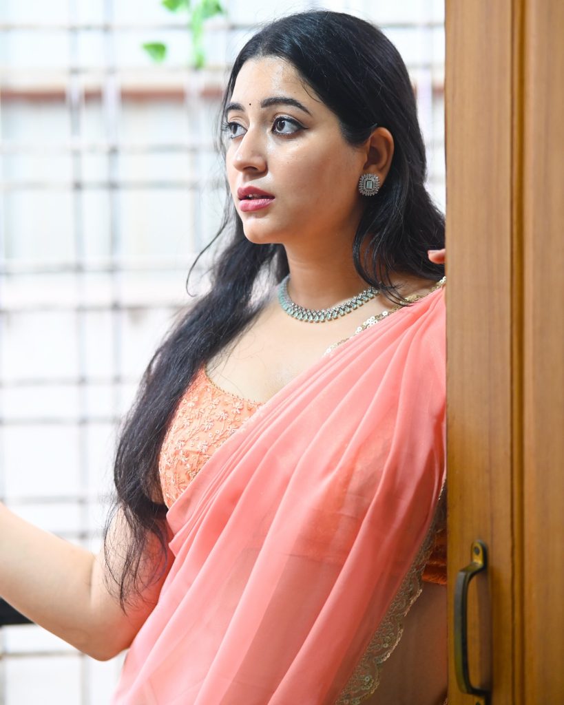 Sudha radiates confidence in rose-colored traditional ensemble