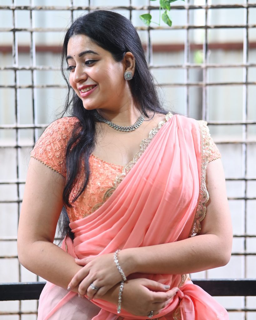 Sudha radiates confidence in rose-colored traditional ensemble