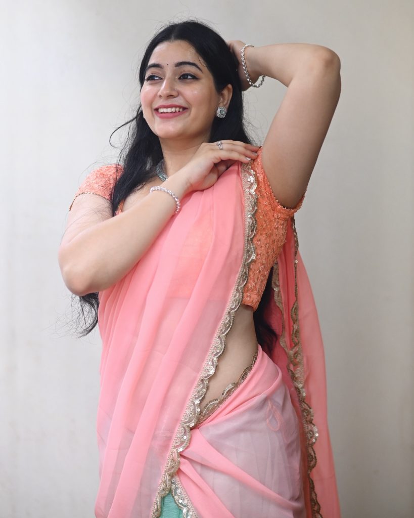 Sudha radiates confidence in rose-colored traditional ensemble