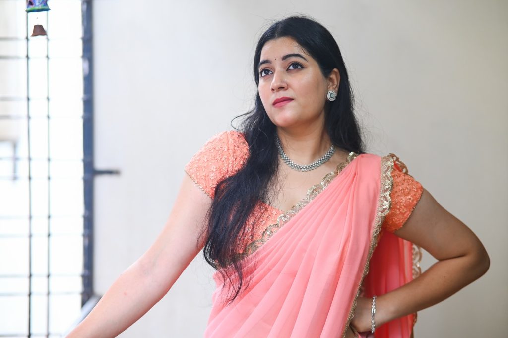 Soft pink hues beautifully captured in Kanduri Sudha's elegant pose