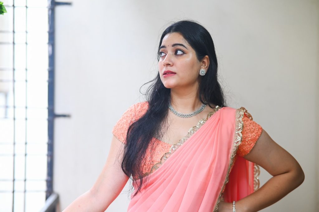 Soft pink hues beautifully captured in Kanduri Sudha's elegant pose