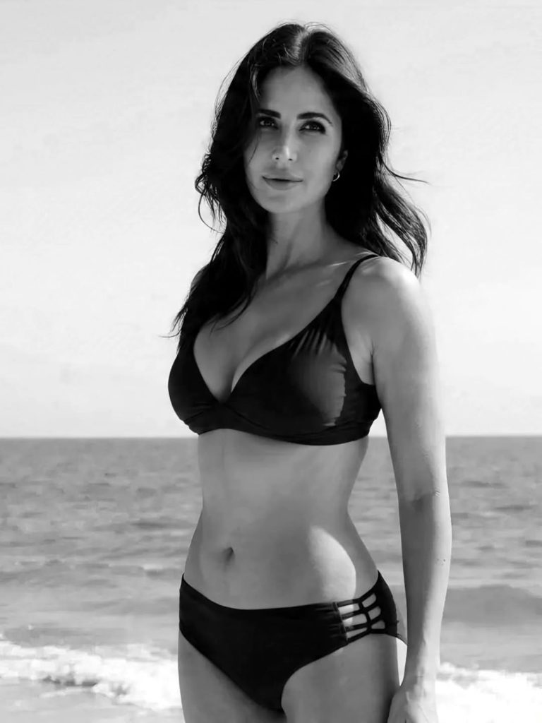 Confident beach pose reflects Katrina's comfort with swimwear styling